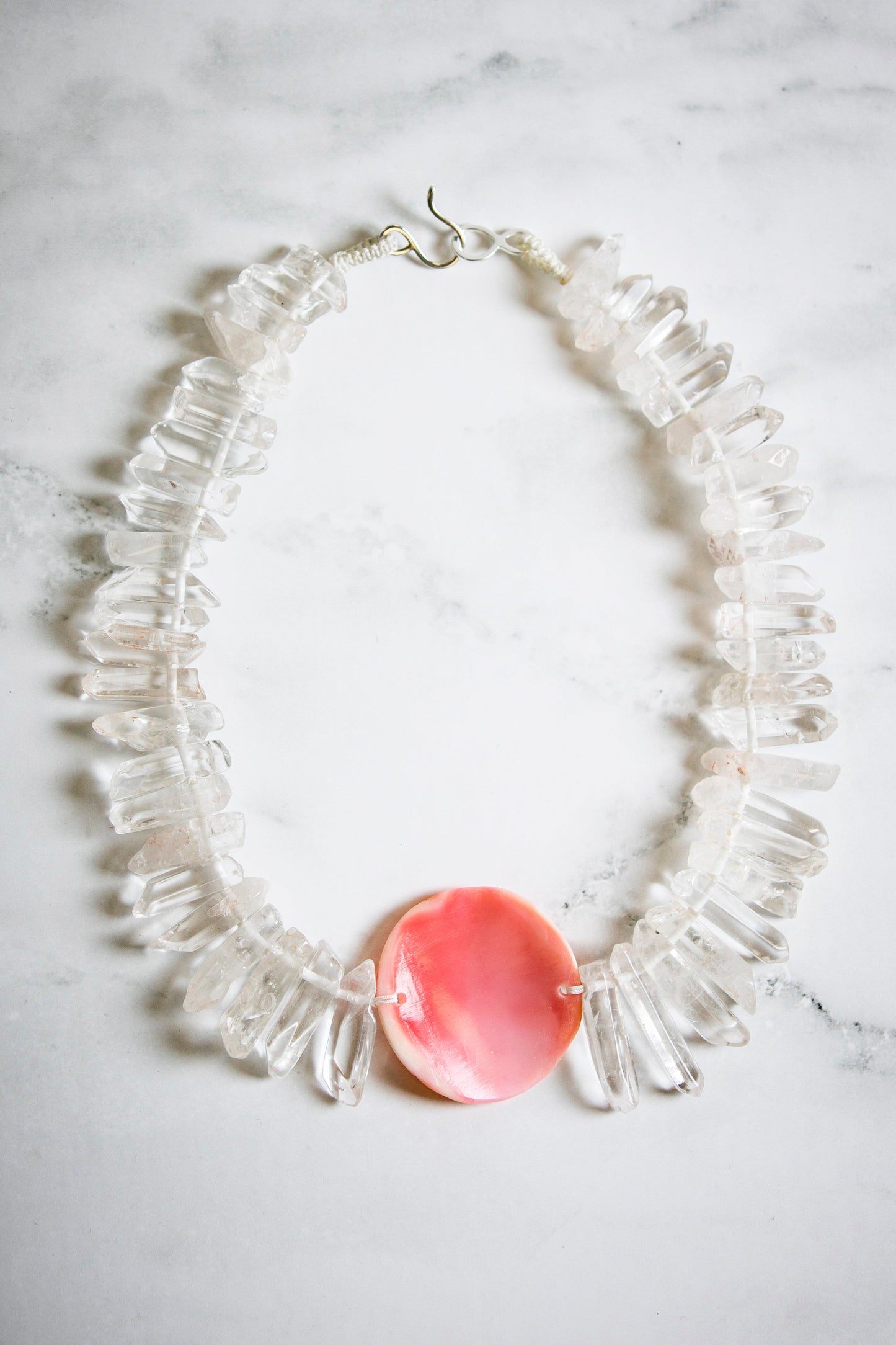 Big Tooth Quartz with Hand Carved Conch Shell Medallion