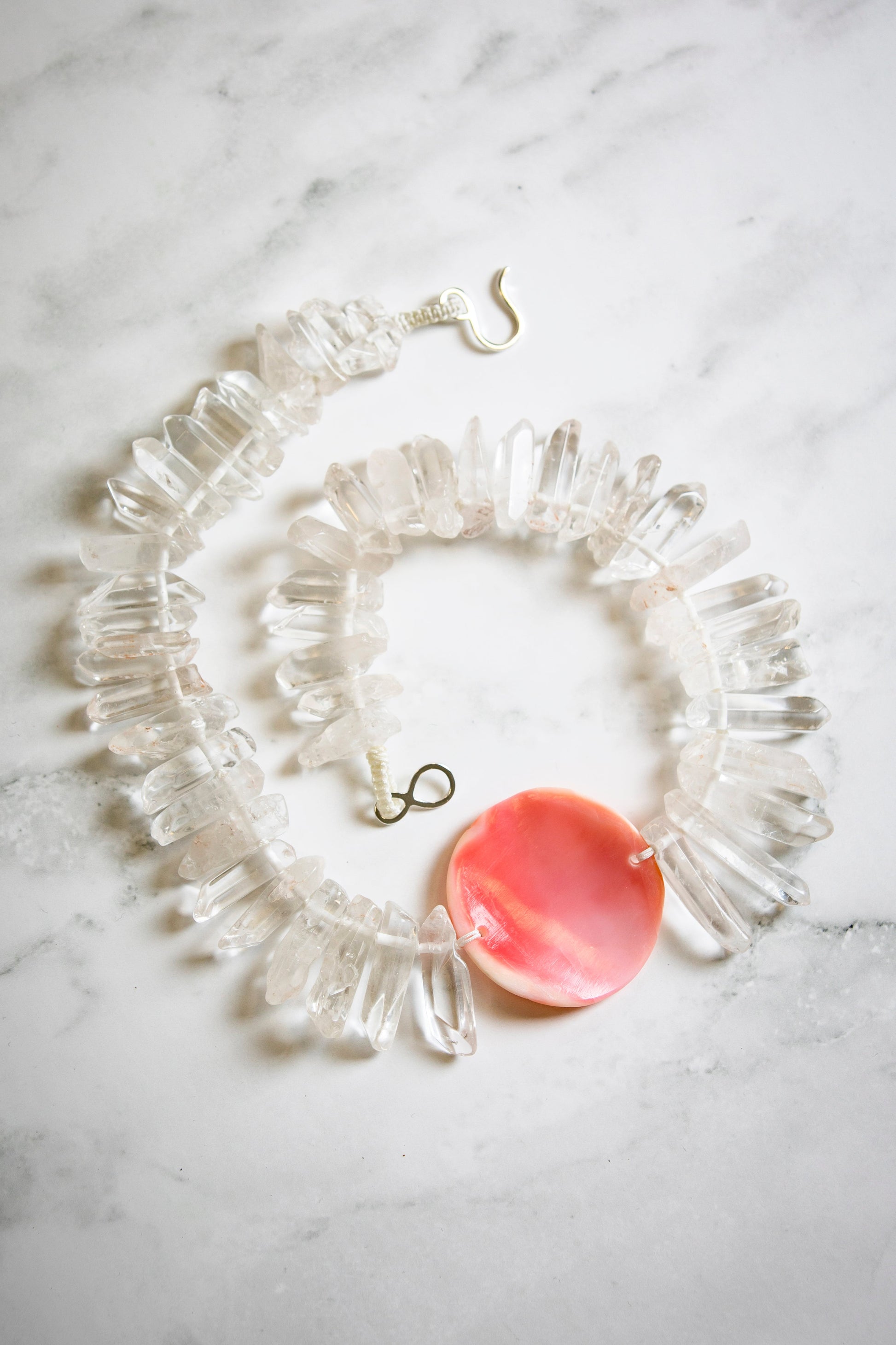 Big Tooth Quartz with Hand Carved Conch Shell Medallion
