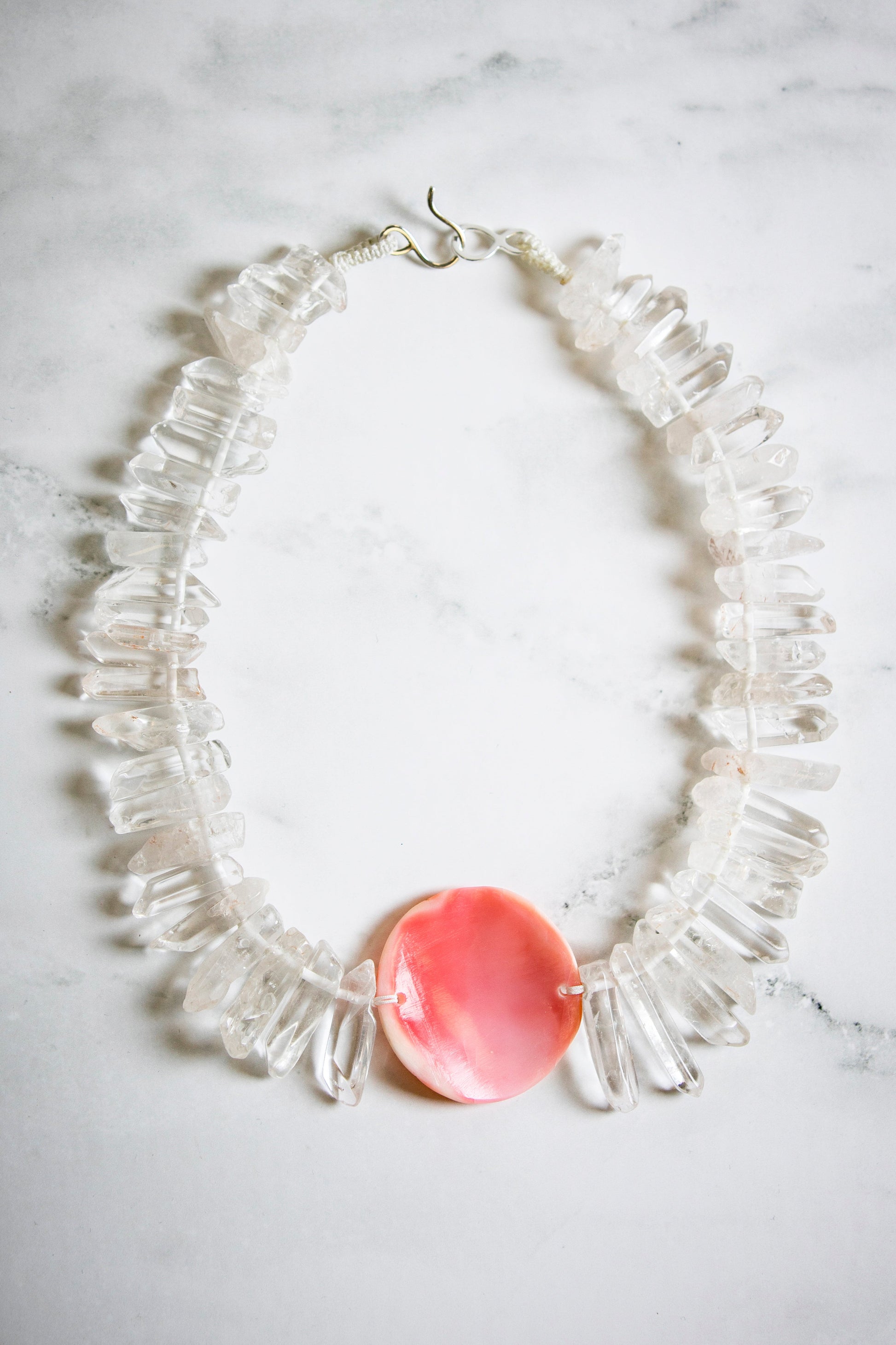 Big Tooth Quartz with Hand Carved Conch Shell Medallion